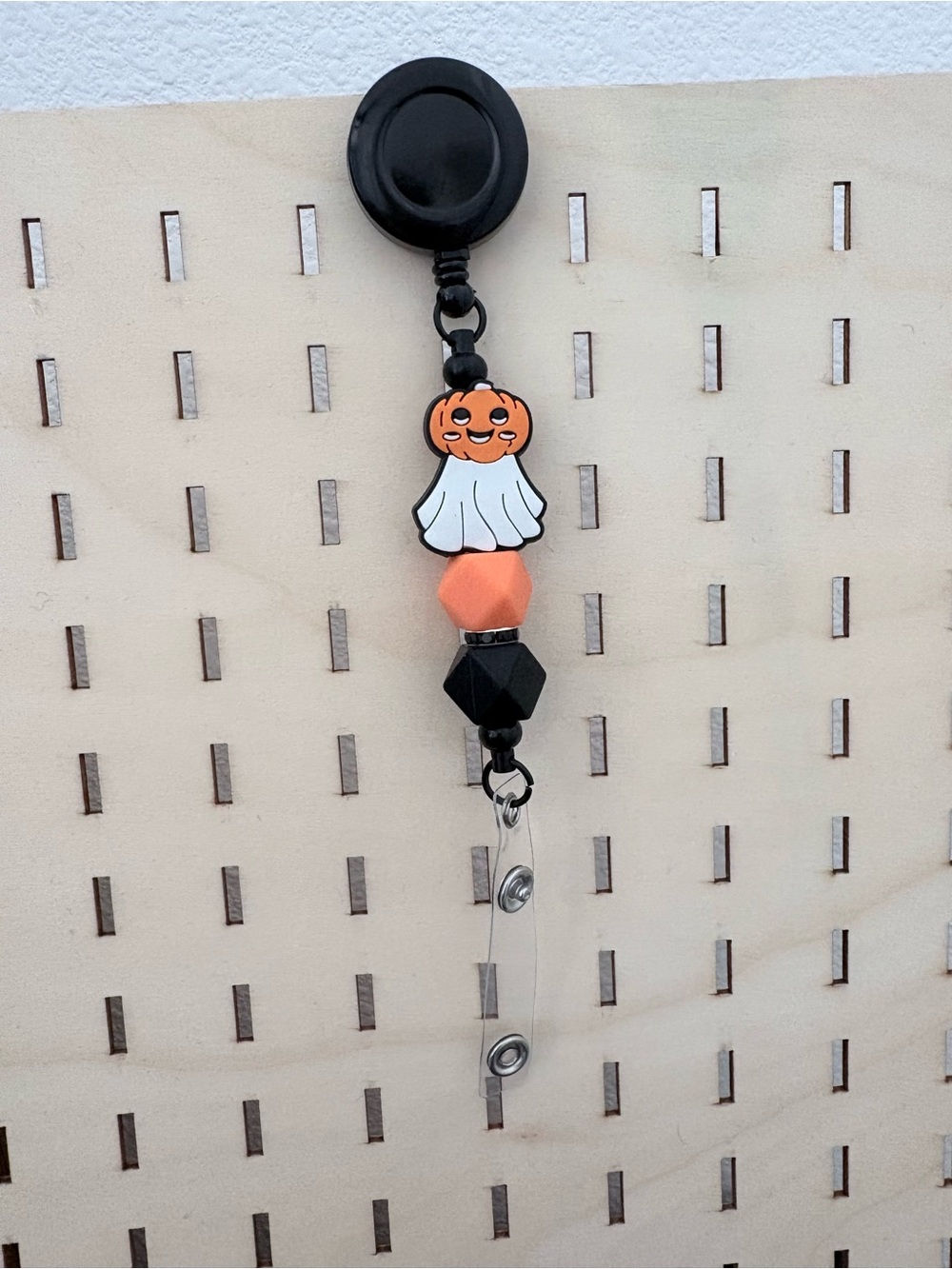 Handcrafted ghost with a pumpkin hat beaded badge reel